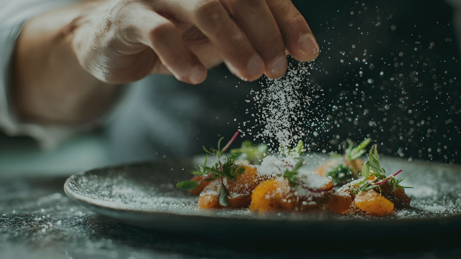 A chef finishing a plate at the Elkhorn restaurant